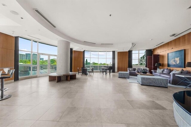 2881 Peachtree Rd NE Unit 1102, Atlanta, GA 30305 - lobby featuring wood walls and a wall of windows