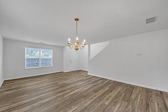 7459 Old Chapel, South Fulton, GA 30349 - unfurnished room with a chandelier, wood finished floors, and baseboards