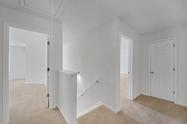 7459 Old Chapel, South Fulton, GA 30349 - hall featuring an upstairs landing, attic access, light colored carpet, and baseboards