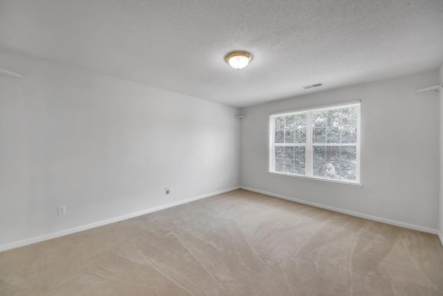 7459 Old Chapel, South Fulton, GA 30349 - empty room featuring carpet floors, baseboards, and a textured ceiling