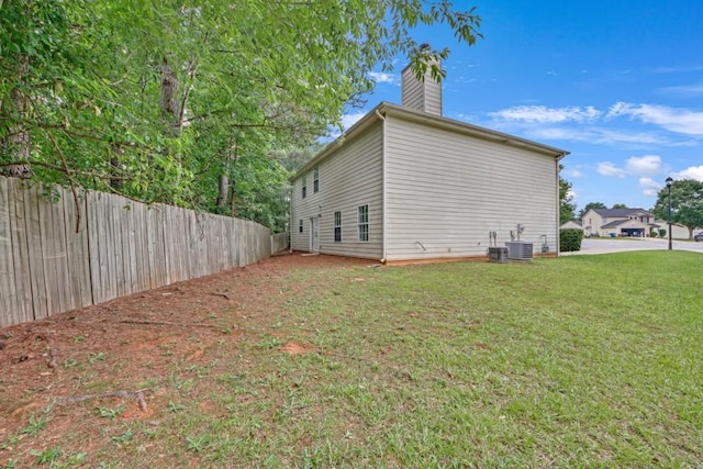7459 Old Chapel, South Fulton, GA 30349 - view of home's exterior featuring a chimney