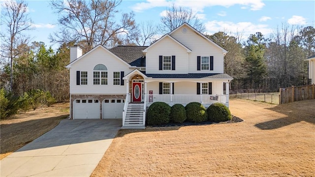 split level home with driveway, fence, covered porch, an attached garage, and a chimney