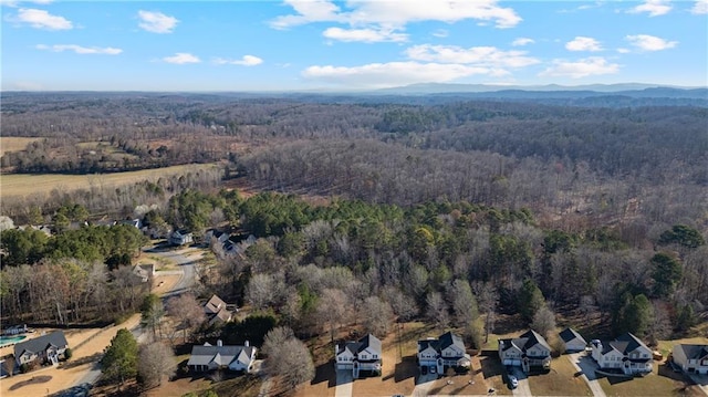 drone / aerial view with a view of trees