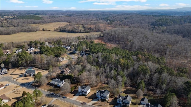 bird's eye view featuring a forest view