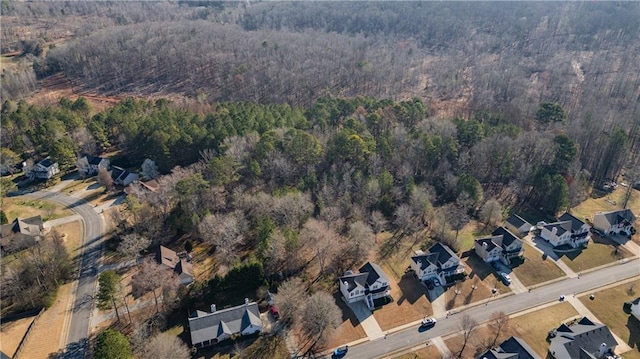 birds eye view of property featuring a residential view and a view of trees