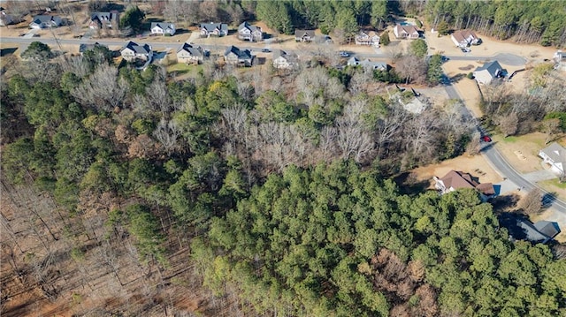 bird's eye view featuring a forest view