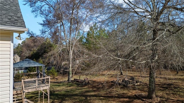 view of yard featuring a wooden deck