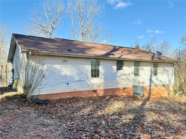 view of side of property featuring central AC unit