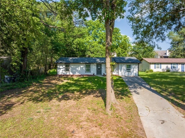 ranch-style house with a front lawn