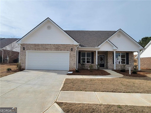 view of front of property with a front lawn, a garage, and a porch