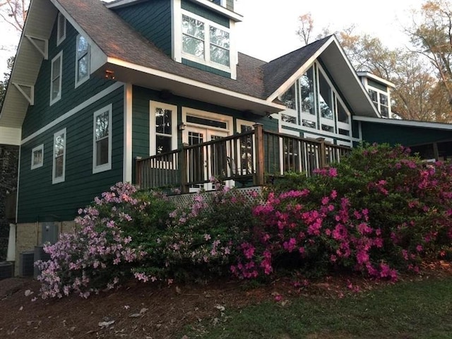 12 Rosalyn Rd, Georgetown, GA 39854 - back of property with cooling unit, a porch, and roof with shingles