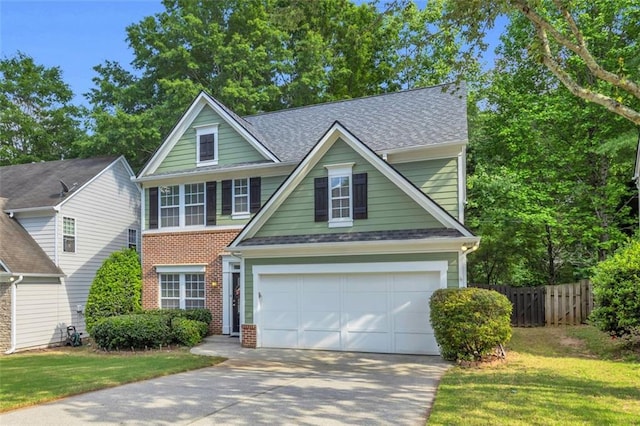335 Pintail Ct, Suwanee, GA 30024 - traditional-style house with driveway, brick siding, roof with shingles, and a garage