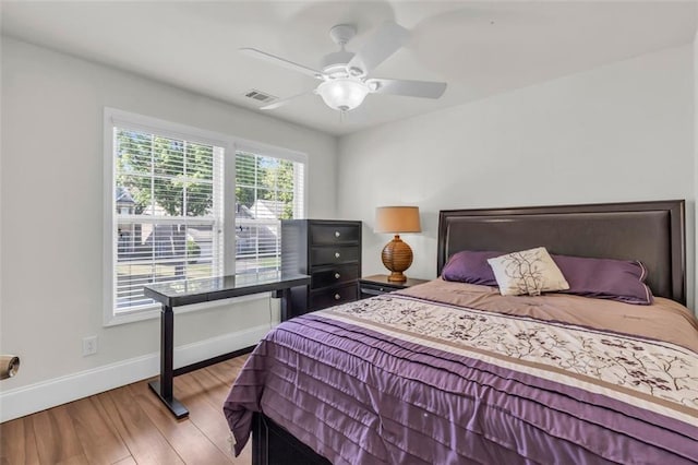 335 Pintail Ct, Suwanee, GA 30024 - bedroom featuring baseboards, wood finished floors, and a ceiling fan