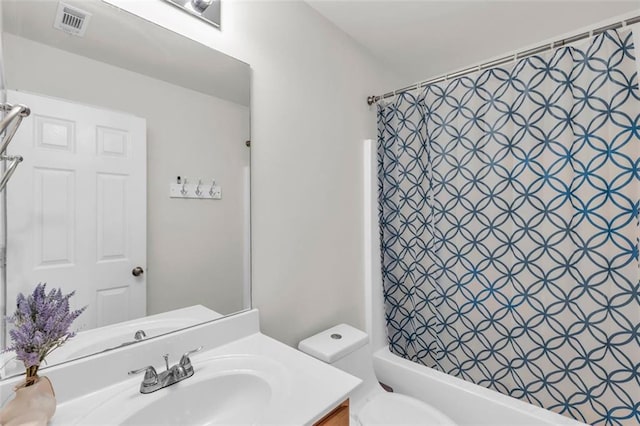 335 Pintail Ct, Suwanee, GA 30024 - bathroom featuring vanity, toilet, and shower / tub combo with curtain
