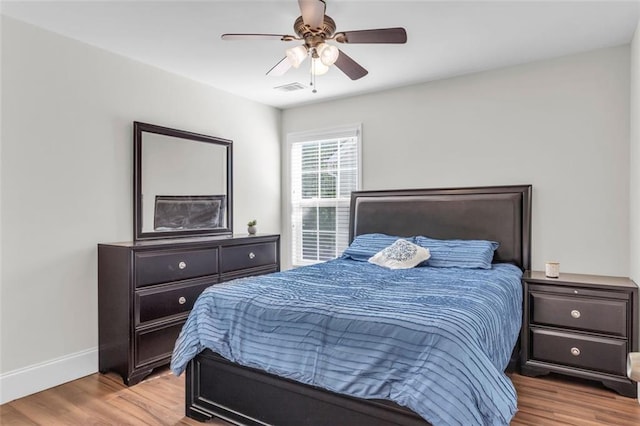 335 Pintail Ct, Suwanee, GA 30024 - bedroom featuring light wood-style flooring, baseboards, and a ceiling fan