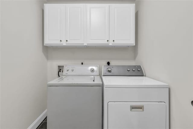 335 Pintail Ct, Suwanee, GA 30024 - laundry area with washer and dryer, cabinet space, and baseboards