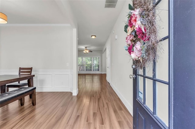 335 Pintail Ct, Suwanee, GA 30024 - entryway with light wood-style floors, a ceiling fan, and crown molding