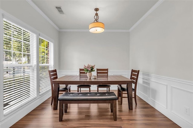 335 Pintail Ct, Suwanee, GA 30024 - dining room with ornamental molding, wood finished floors, and a wainscoted wall