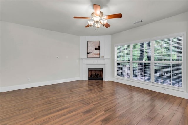 335 Pintail Ct, Suwanee, GA 30024 - unfurnished living room with a fireplace, wood finished floors, ceiling fan, and baseboards