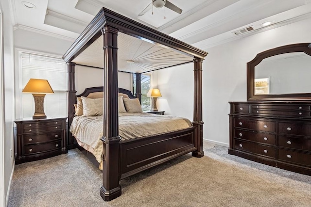 bedroom featuring crown molding, a raised ceiling, light colored carpet, visible vents, and baseboards
