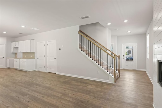 7127 Brushwood Bnd, Lithonia, GA 30058 - interior space with stairway, wood finished floors, and recessed lighting