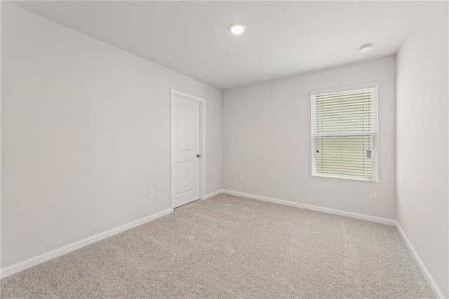 7127 Brushwood Bnd, Lithonia, GA 30058 - spare room with baseboards and light carpet