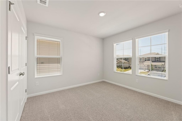 7127 Brushwood Bnd, Lithonia, GA 30058 - unfurnished room featuring baseboards, visible vents, light carpet, and recessed lighting