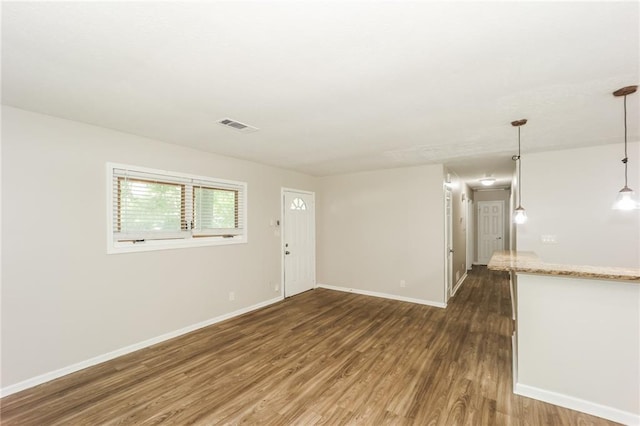 spare room with dark wood-type flooring