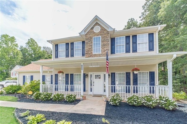 206 Belmont Dr, Monroe, GA 30655 - view of front of house with a porch and stone siding