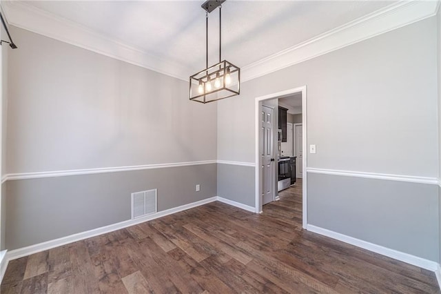 206 Belmont Dr, Monroe, GA 30655 - unfurnished dining area featuring ornamental molding, dark wood-style flooring, a chandelier, and baseboards