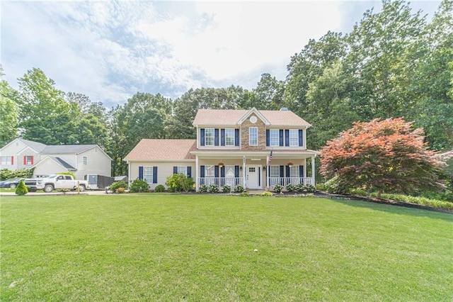 206 Belmont Dr, Monroe, GA 30655 - colonial inspired home featuring a porch and a front yard