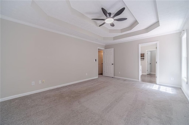 206 Belmont Dr, Monroe, GA 30655 - unfurnished bedroom featuring a raised ceiling, light carpet, crown molding, baseboards, and a ceiling fan