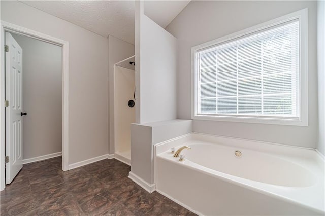 206 Belmont Dr, Monroe, GA 30655 - full bathroom with a garden tub, walk in shower, and baseboards