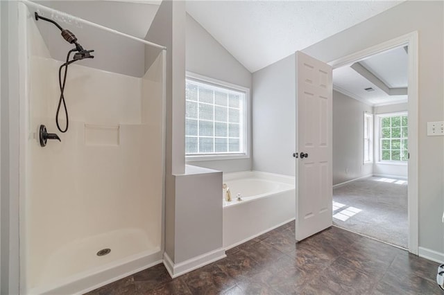 206 Belmont Dr, Monroe, GA 30655 - full bath featuring a shower stall, baseboards, a garden tub, stone finish flooring, and lofted ceiling
