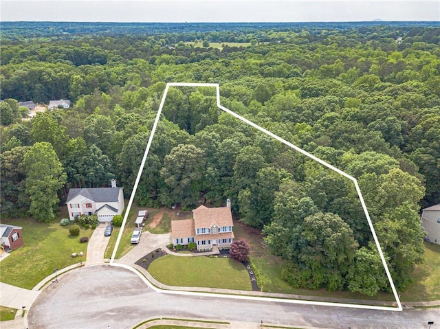 206 Belmont Dr, Monroe, GA 30655 - aerial view of property and surrounding area featuring a forest and property parcel outlined