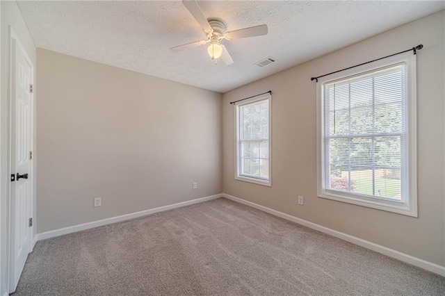 206 Belmont Dr, Monroe, GA 30655 - empty room with a textured ceiling, baseboards, light colored carpet, and a ceiling fan