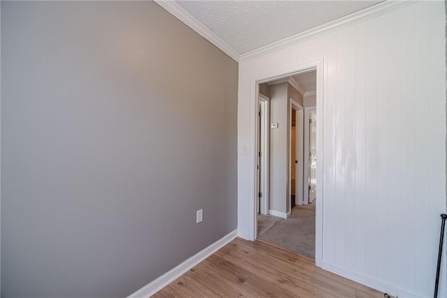 206 Belmont Dr, Monroe, GA 30655 - spare room featuring crown molding, light wood finished floors, and baseboards