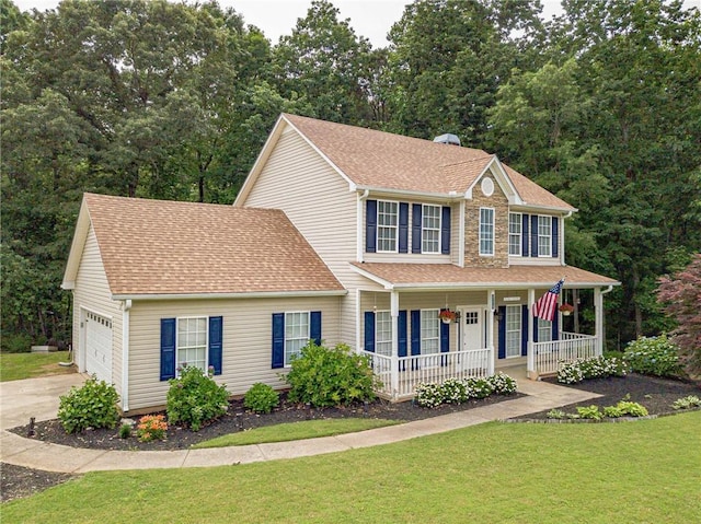 206 Belmont Dr, Monroe, GA 30655 - colonial inspired home with covered porch, a front yard, an attached garage, a shingled roof, and concrete driveway