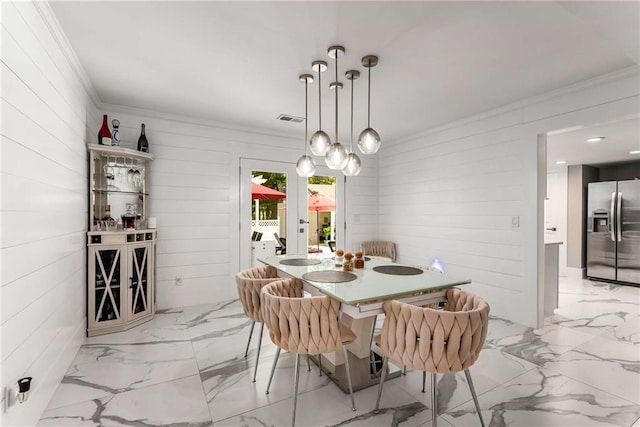 5219 Legendary Ln, Acworth, GA 30102 - dining room with ornamental molding, french doors, light marble finish flooring, and wooden walls