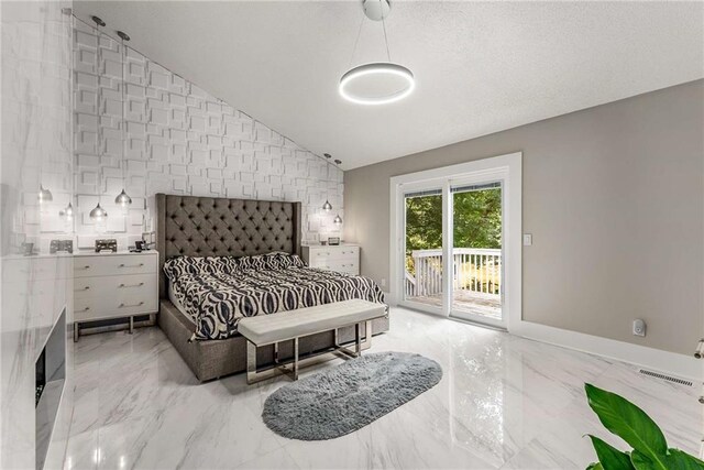 5219 Legendary Ln, Acworth, GA 30102 - bedroom featuring access to outside, light marble finish floors, lofted ceiling, and baseboards