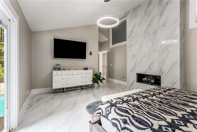 5219 Legendary Ln, Acworth, GA 30102 - bedroom featuring marble tiled flooring, vaulted ceiling, baseboards, and access to outside