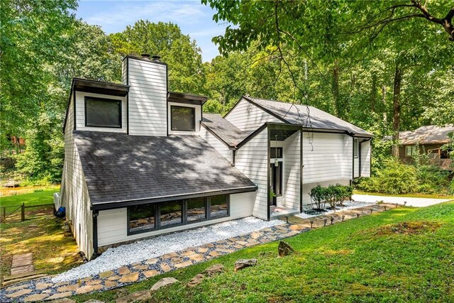 5219 Legendary Ln, Acworth, GA 30102 - back of property with a chimney and roof with shingles