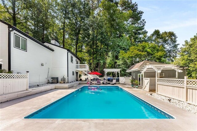 5219 Legendary Ln, Acworth, GA 30102 - view of pool featuring a pergola, a patio area, and view of scattered trees