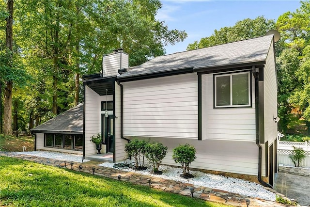 5219 Legendary Ln, Acworth, GA 30102 - view of side of home featuring a chimney and a shingled roof