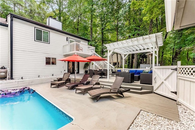 5219 Legendary Ln, Acworth, GA 30102 - swimming pool featuring an outdoor hangout area, a pergola, a patio, view of wooded area, and a wooden deck