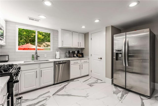 5219 Legendary Ln, Acworth, GA 30102 - kitchen featuring stainless steel appliances, light countertops, a sink, white cabinetry, and recessed lighting