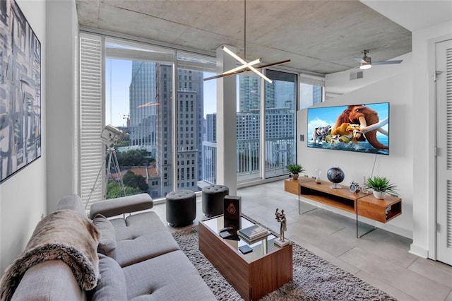 living room featuring light tile patterned flooring, floor to ceiling windows, and ceiling fan