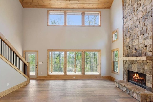 78 Pocola Ct, Ellijay, GA 30536 - unfurnished living room featuring plenty of natural light, wood ceiling, wood finished floors, and a fireplace