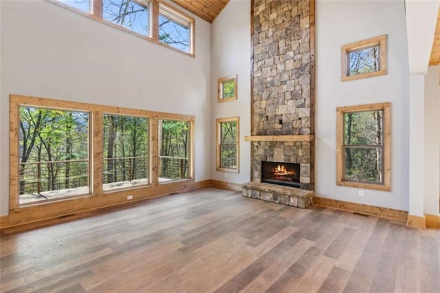 78 Pocola Ct, Ellijay, GA 30536 - unfurnished living room featuring a fireplace, high vaulted ceiling, baseboards, wooden ceiling, and wood finished floors