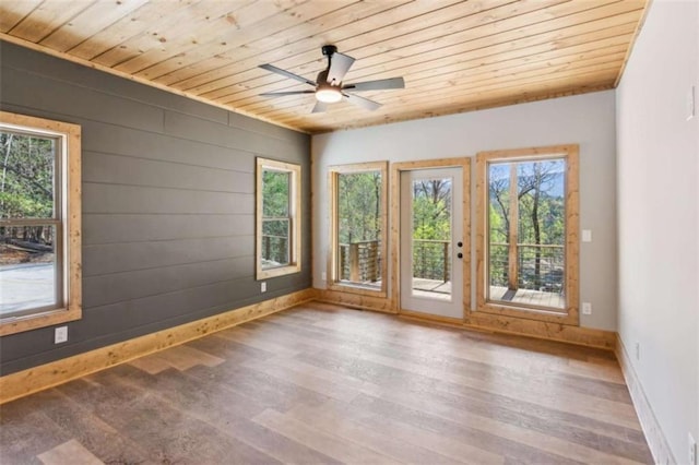 78 Pocola Ct, Ellijay, GA 30536 - spare room with a ceiling fan, baseboards, wooden ceiling, and wood finished floors